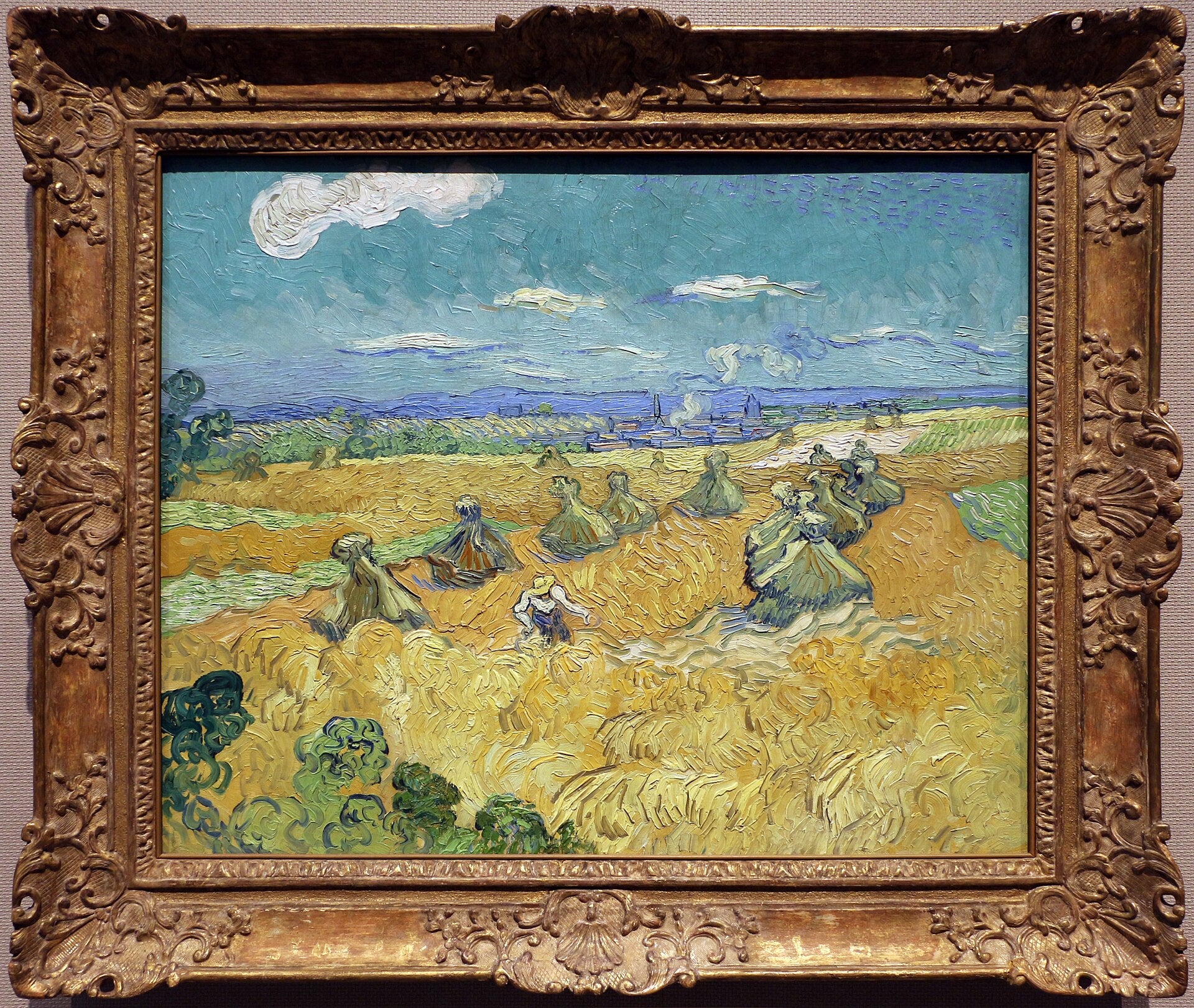 Reproduction du tableau « Champ de blé avec gerbes et moissonneuse - Vincent van Gogh » par Alpha Reproduction en peinture à l’huile