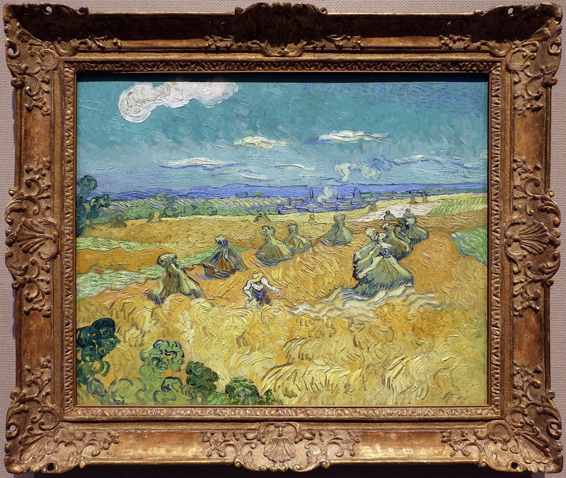 Campo de trigo com feixes e ceifeira - Vincent van Gogh
