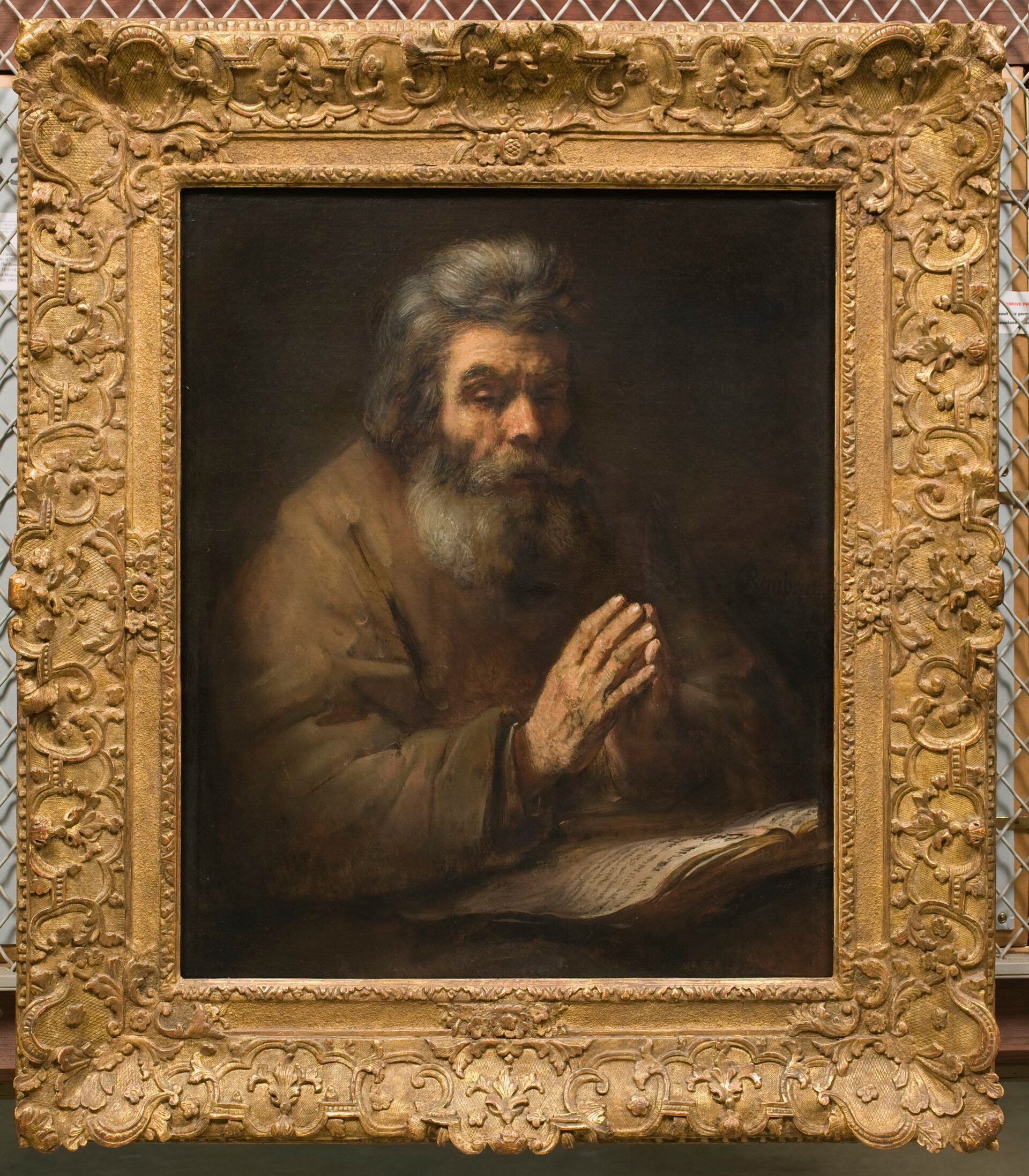 Um homem idoso em oração - Rembrandt